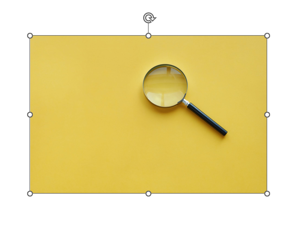 magnifying glass on yellow table